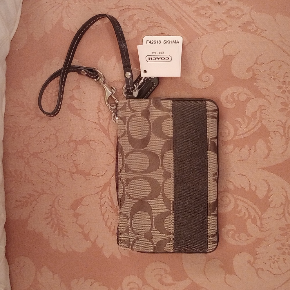 Nwt. Coach Signature C Brown and tan wristlet.